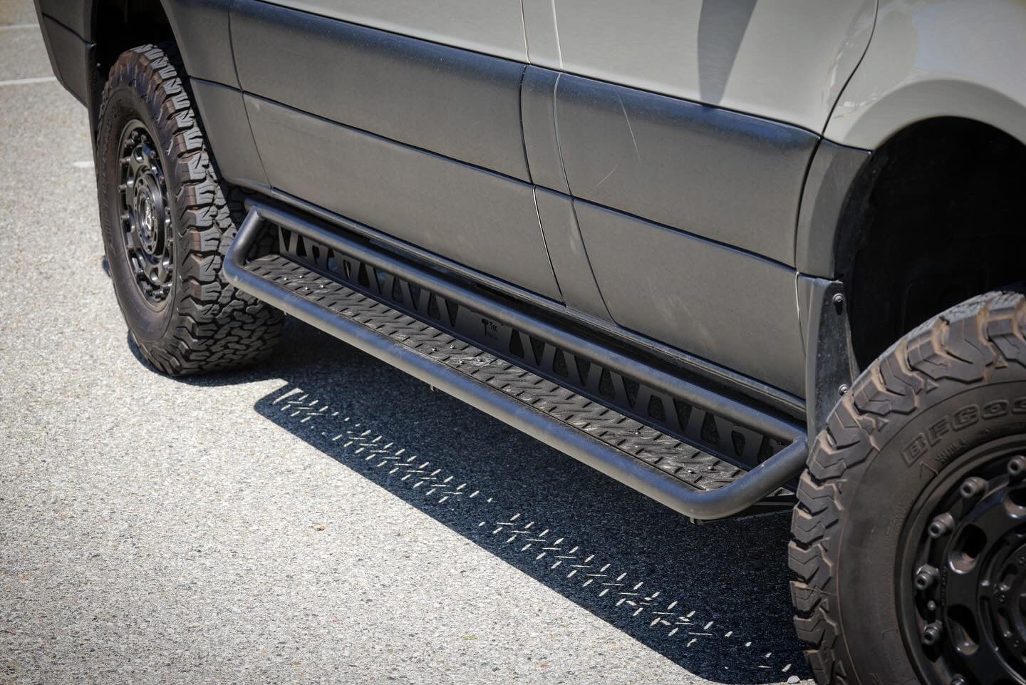 Full-length wheelbase-specific aluminum running board on a Mercedes Sprinter