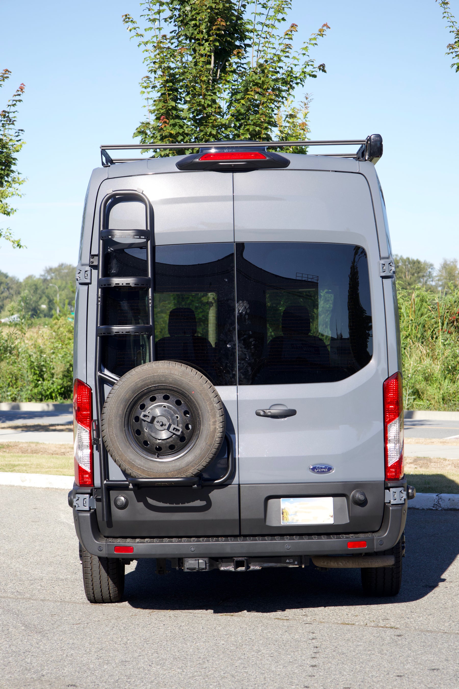 Tec Vanlife two-in-one tire ladder carrier installed on a Ford Transit