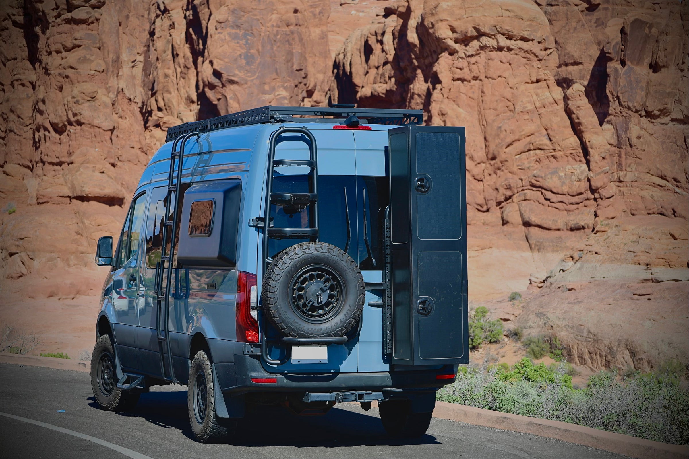 Tec Vanlife two-in-one tire ladder carrier and rear-door system installed on a Mercedes Sprinter