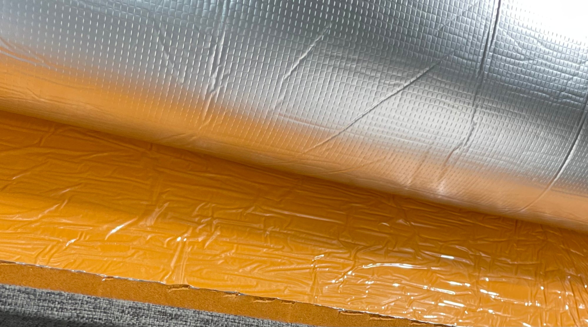 Reflective foil surface of Duck Liner installed in a van conversion